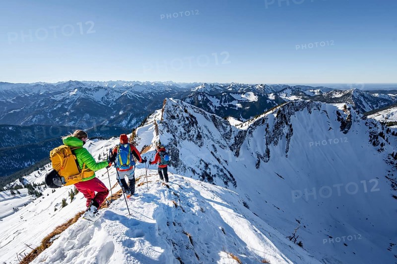 Ski tourers in winter on the snow-covered Rotwand, mountains in winter