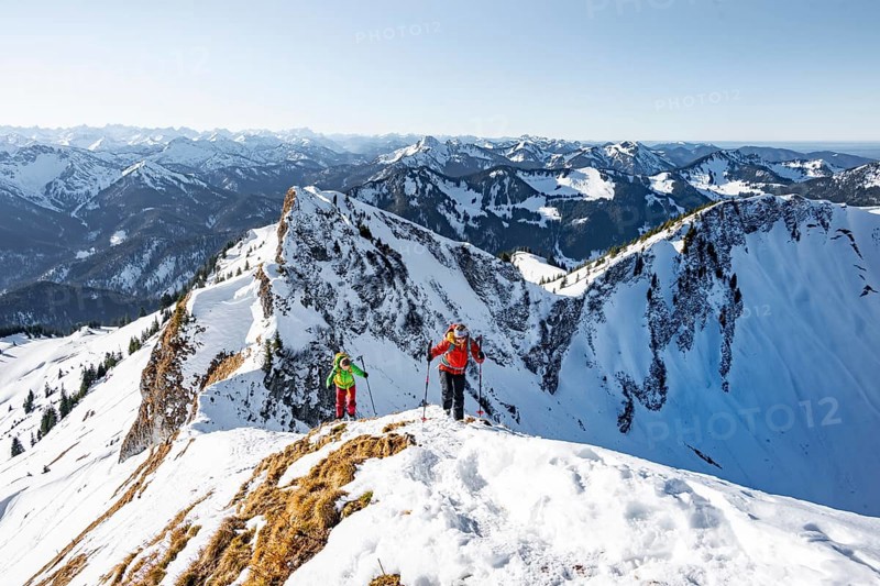 Ski tourers in winter on the snow-covered Rotwand, mountains in winter