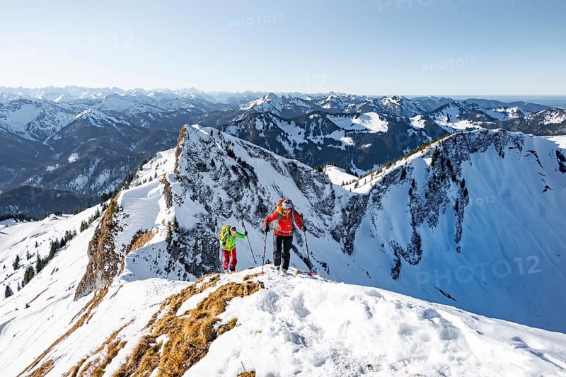 Ski tourers in winter on the snow-covered Rotwand, mountains in winter