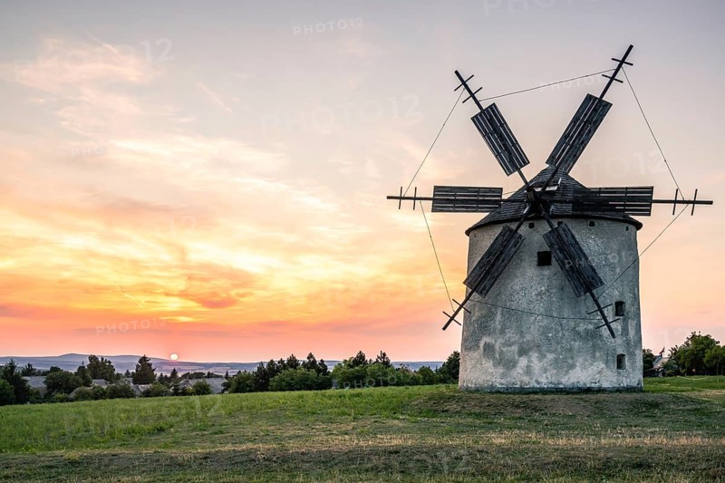 Old historic windmills in the sunset Tesi, balaton