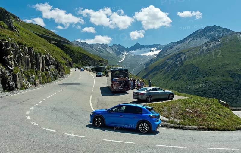 Rest area with coach and cars on the pass road to the Furka Pass, Gletsch