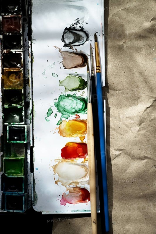 Watercolour paint box with brushes,