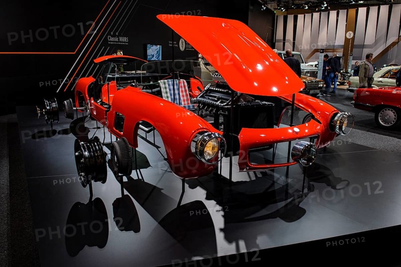 Cutaway model in the style of technical exploded view of vintage historic sports car Mercedes-Benz 300 SL Gullwing, Techno Classica trade fair