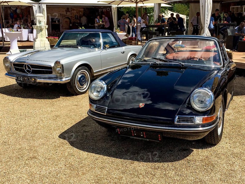 In front classic sports car Porsche 911 Urelfer from the 60s, behind historic sports car Mercedes SL