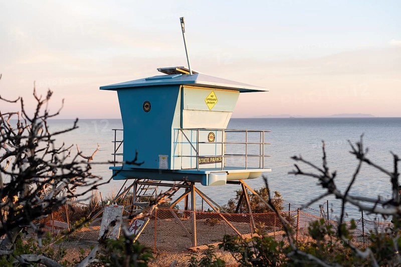 A lifeguard tower at sunset in El Matador Beach, Malibu