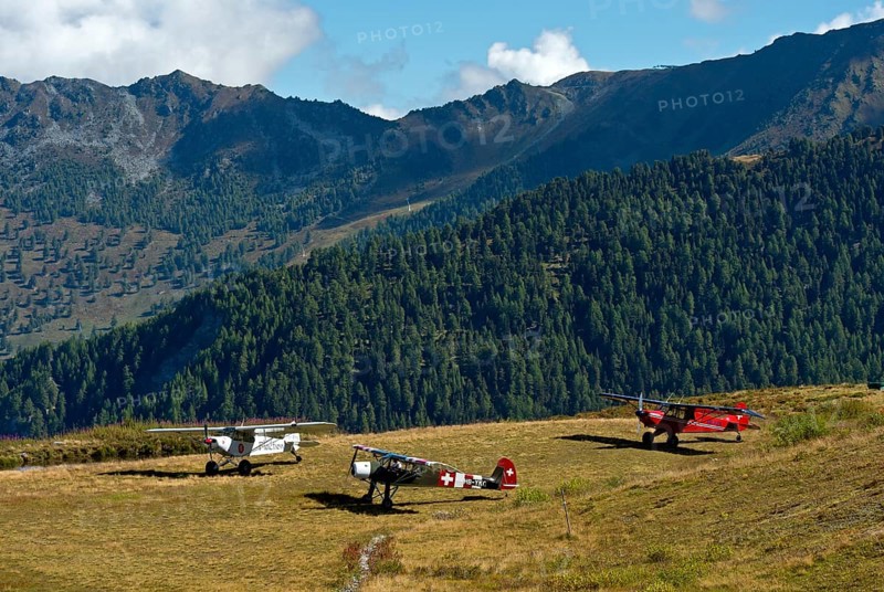 Three aircraft on the Croix-de-Coeur mountain landing field Verbier, from left to right. Piper PA-18-150 Super Cub HB-PMN