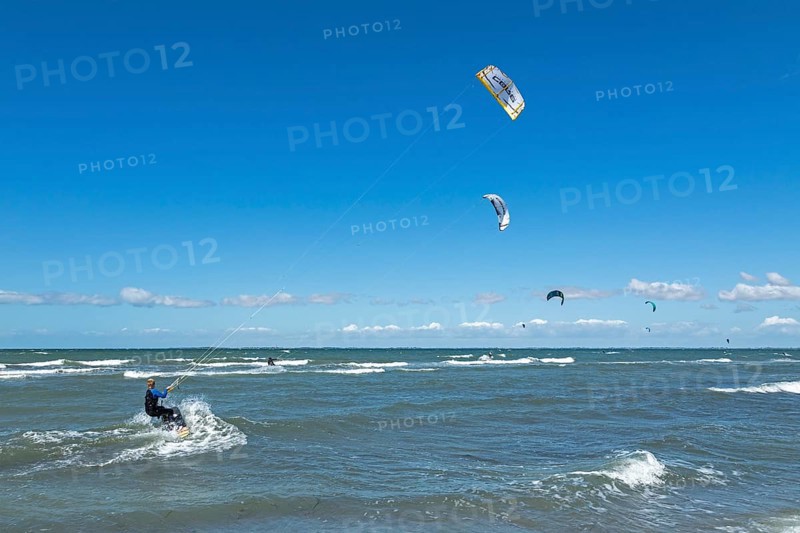 Kitesurfer in front of Graswarder peninsula, Heiligenhafen