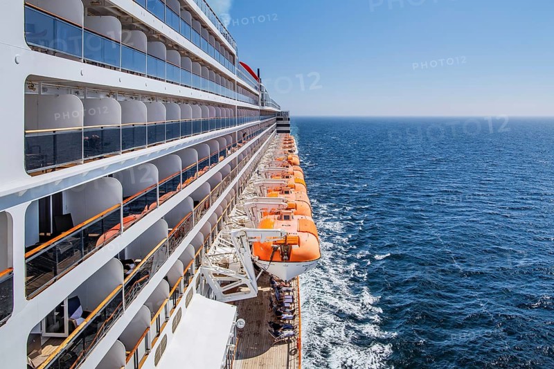 Transatlantic liner, Queen Mary 2 cruise ship on the high seas with boat deck and balcony cabins