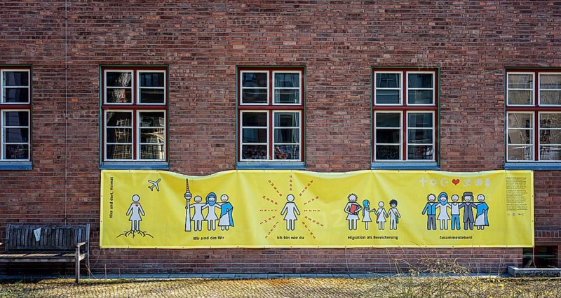 Yellow poster at a migratory centre in Kreuzberg, Berlin
