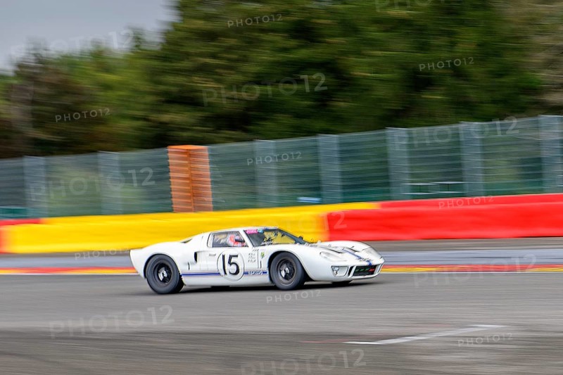 Photo of historic racing car Ford GT40 on Spa Francorchamps race track in curve 1 La Source, Ardennes roller coaster