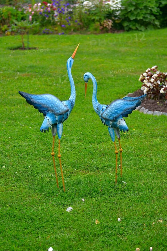 Metal Heron Figures in the Garden