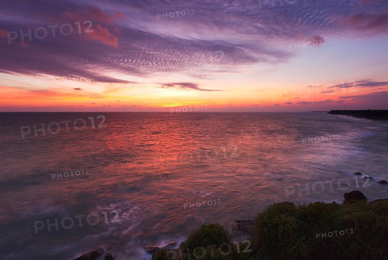 Ocean sunset on rocky coast. Varkala
