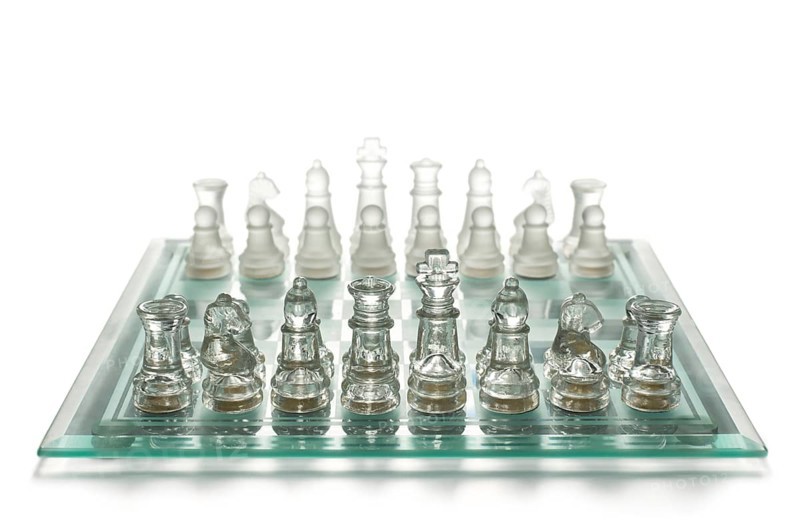Glass chess on chess board
