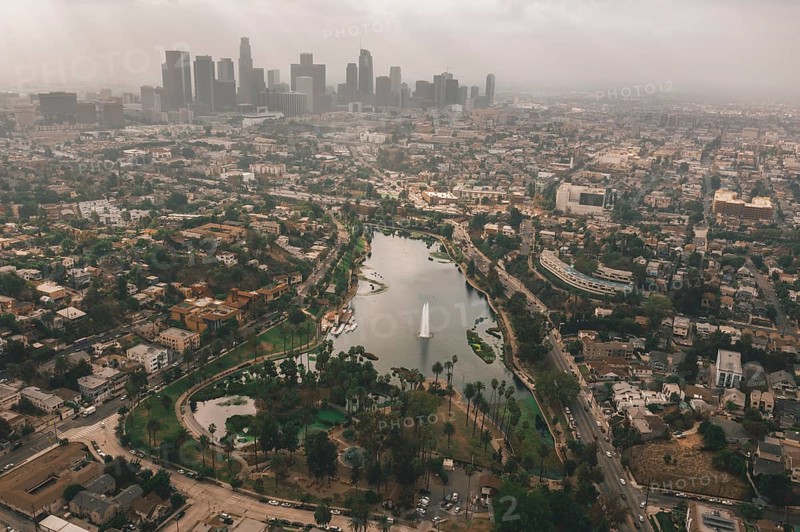 Echo Park in Los Angeles with View of Downtown Skyline and Foggy Polluted Smog Air in Big Urban City HQ