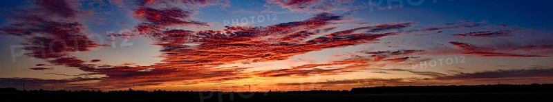 Sunset with red coloured clouds on the evening of the solstice