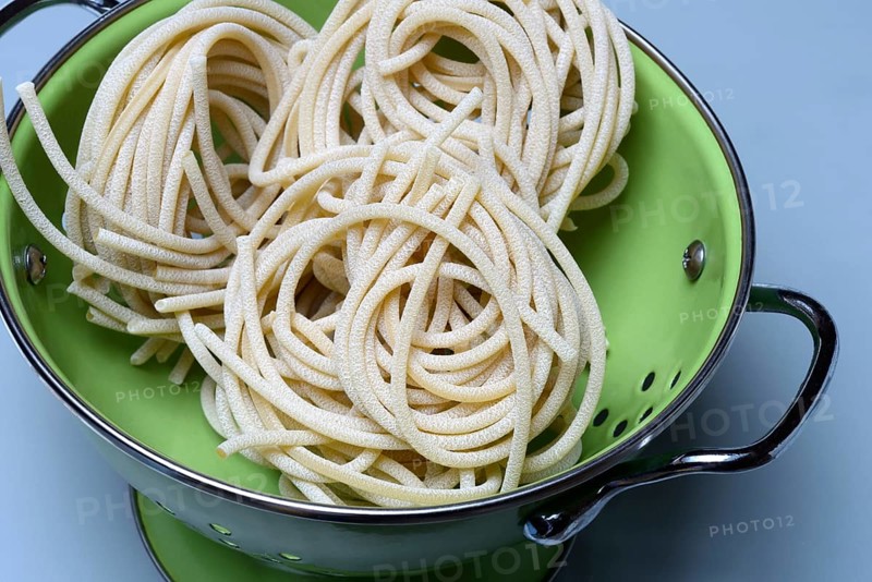 Pici pasta in kitchen colander