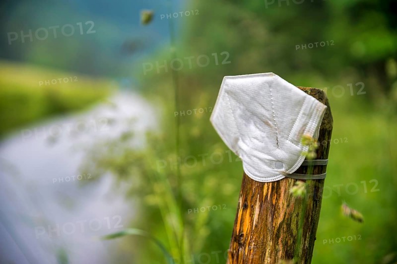 FFP2 mask on the post of a pasture fence