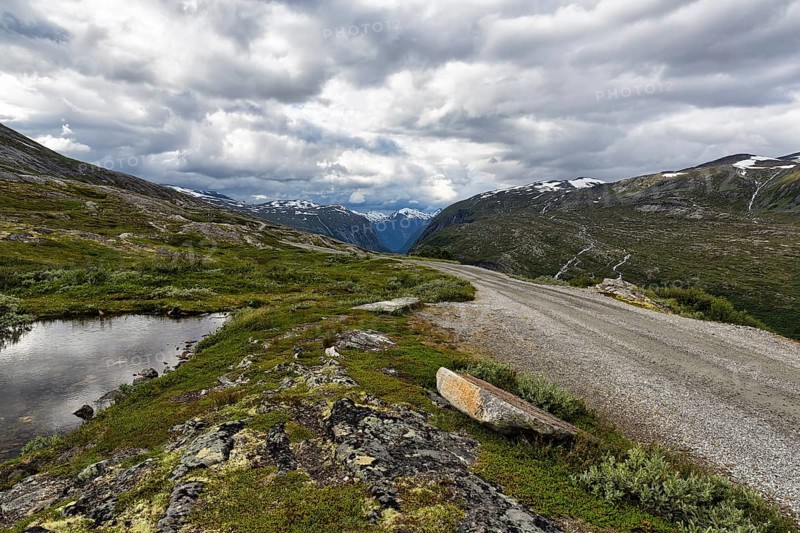 Gravel road through barren mountain landscape