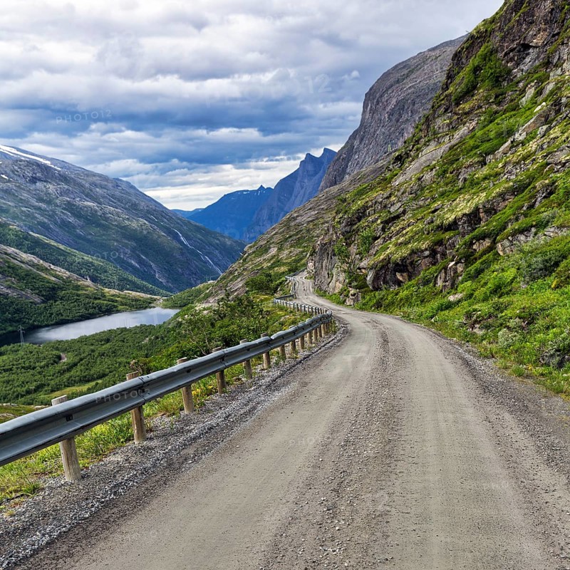 Gravel road through typical mountain landscape