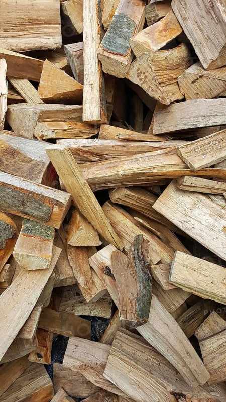 Delivery of firewood in the pile. Split and dried ready for the stove