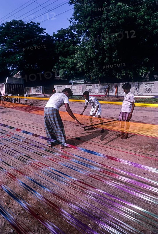 Colorful cotton sungudi saris under operation at Madurai