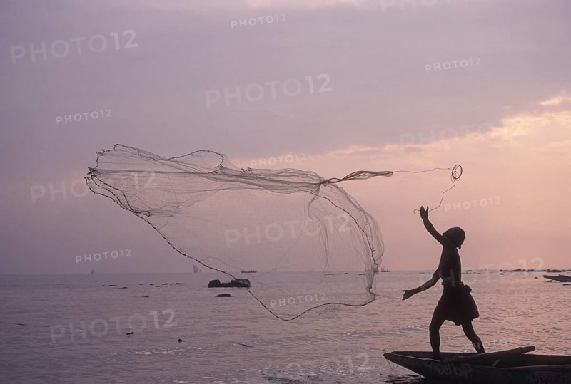 Fishing against Sun rise