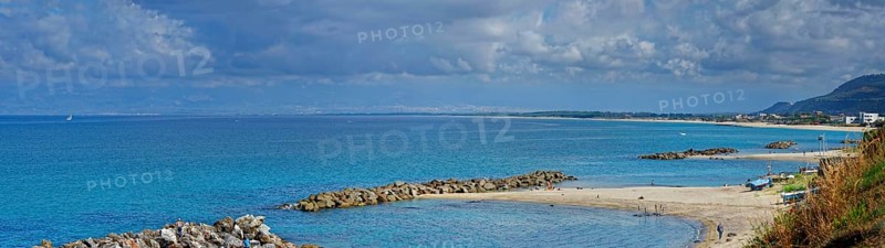 Sandy beach beach with turquoise sea at the Grotte Piedigrotta