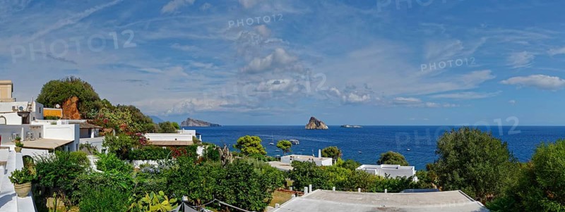 Town of Panarea overlooking the small island of Le Guglie and di Basiluzzo of a former volcano
