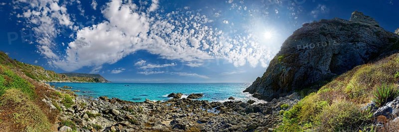 Bay Capo Vaticano with turquoise sea and bizarre sky