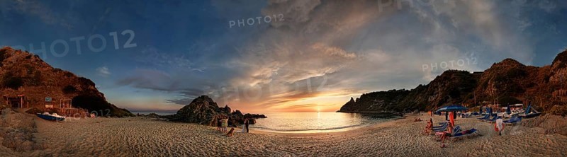 Panorama on the sandy beach and bay Capo Vaticano at sunset
