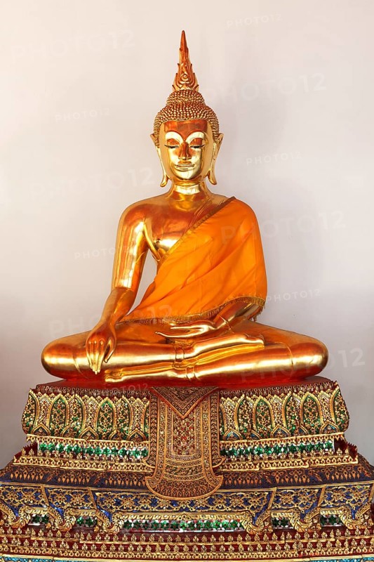 Sitting Buddha Gold Statue close up in Buddhist Temple. Wat Pho