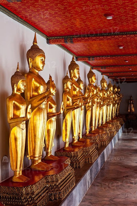Standing golden Buddha statues. Wat Pho temple