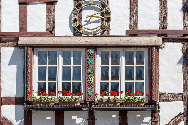 Half-timbered house with clock