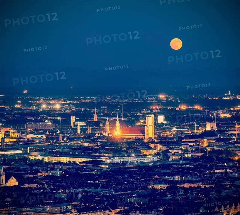 Vintage retro hipster style travel image of night aerial view of Munich from Olympiaturm