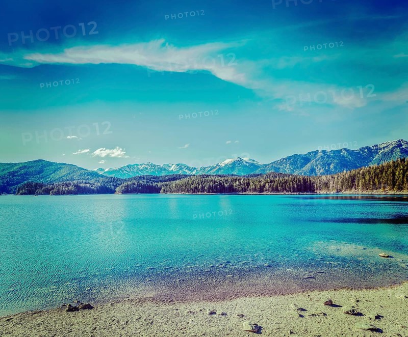 Vintage retro hipster style travel image of Eibsee lake. Bavaria