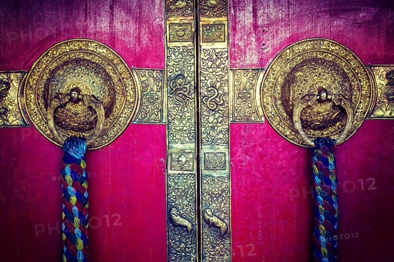 Vintage retro hipster style travel image of door handles on gates of Ki monastry. Spiti Valley
