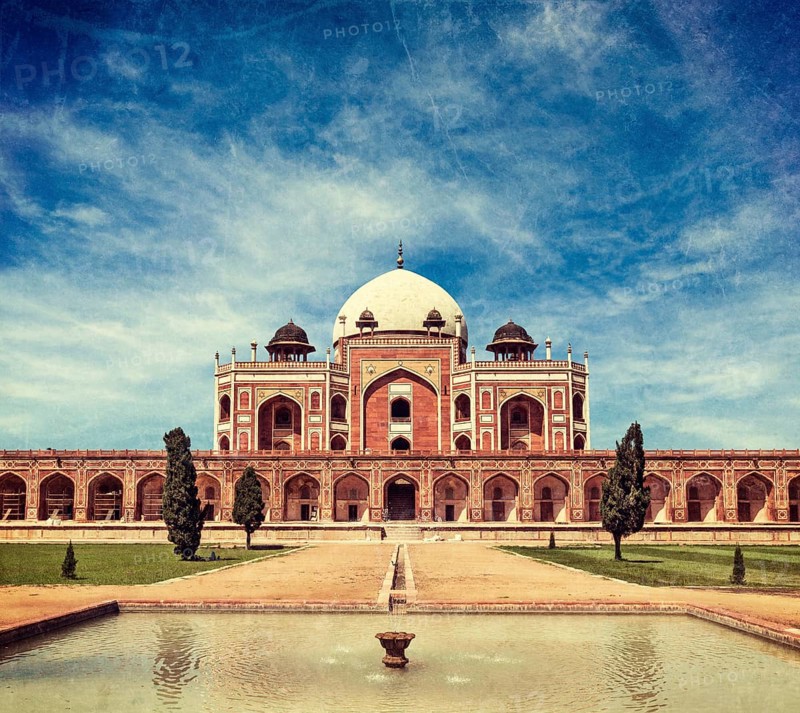 Vintage retro hipster style travel image of Humayun's Tomb with overlaid grunge texture. Delhi