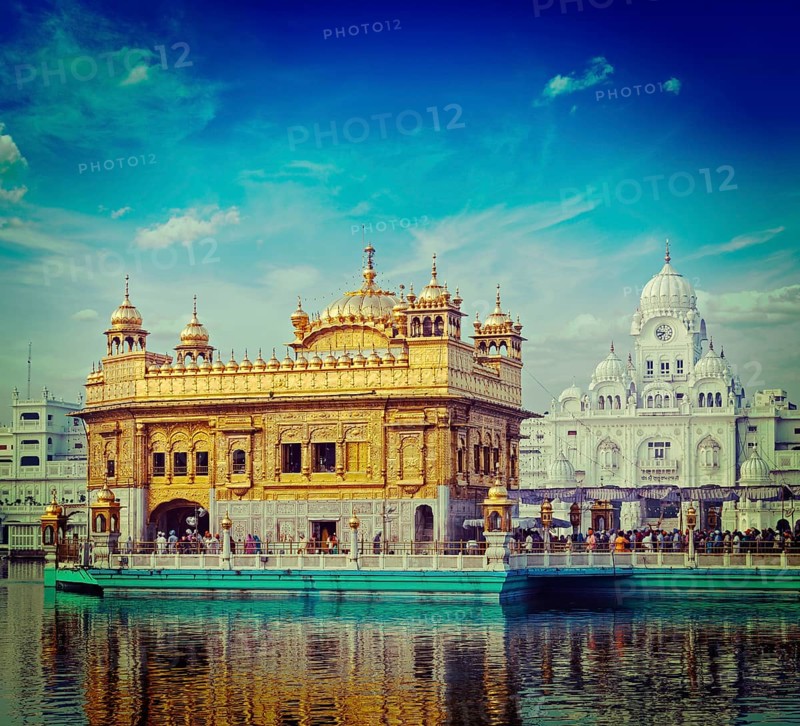 Vintage retro hipster style travel image of famous India attraction Sikh gurdwara Golden Temple