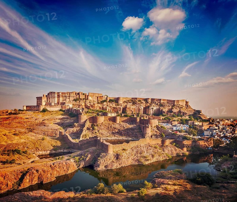 Retro vintage hipster style image of Mehrangarh Fort and Padamsar Talab and Ranisar Talab lakes on sunset