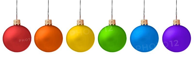 Several hanging Christmas baubles isolated on white background
