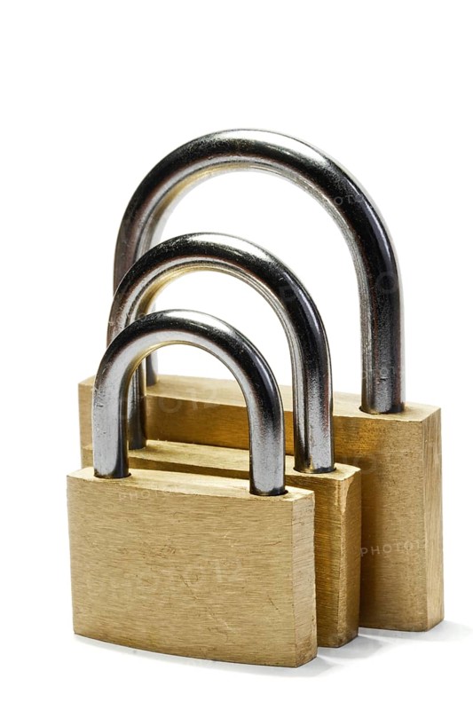 Three padlocks of different size isolated on white