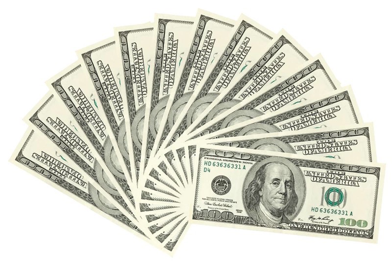Hundreds of dollars spread on white background