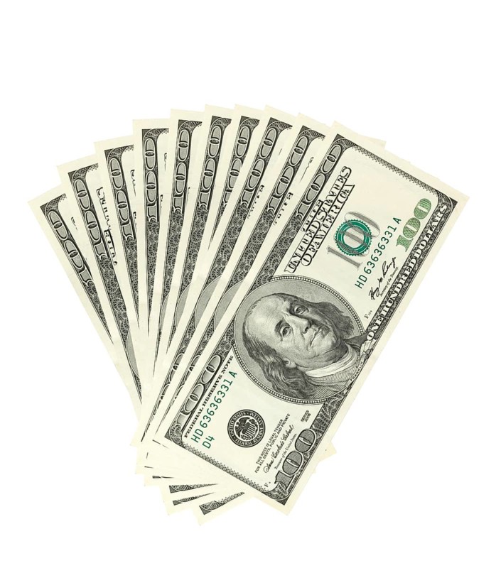 Hundreds of dollars spread on white background