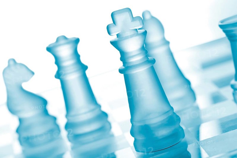 Glass chess on chess board
