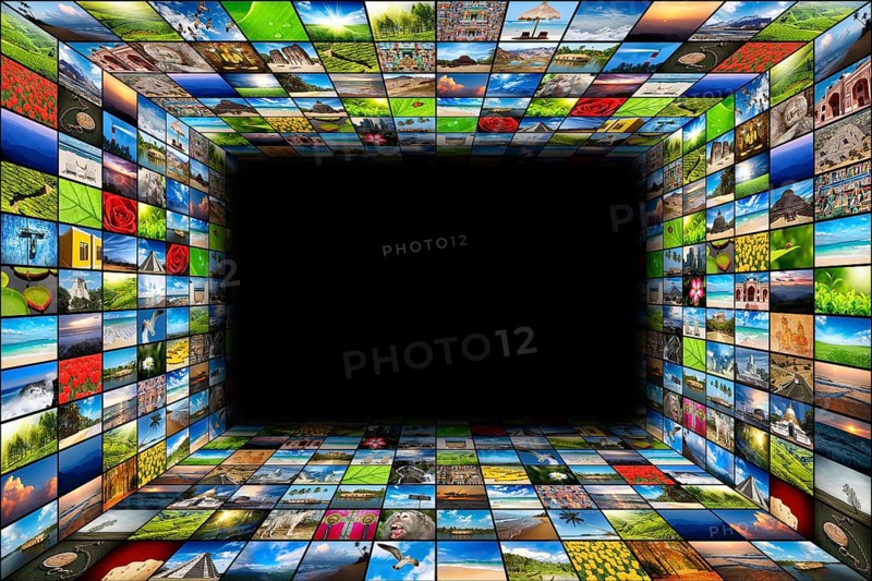 Abstract multimedia background composed of many images with copyspace in the center