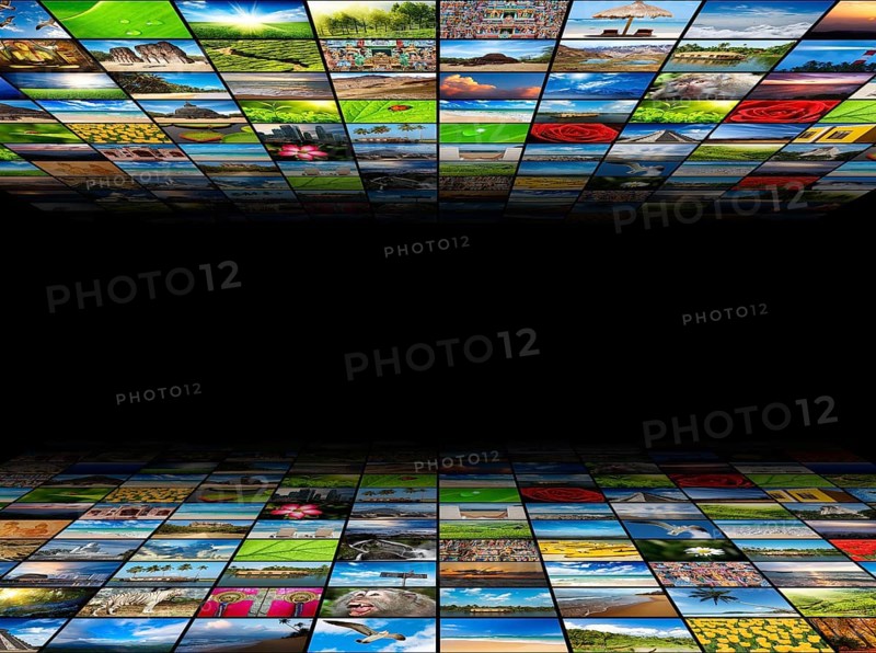 Abstract multimedia background composed of many images with copyspace in the center
