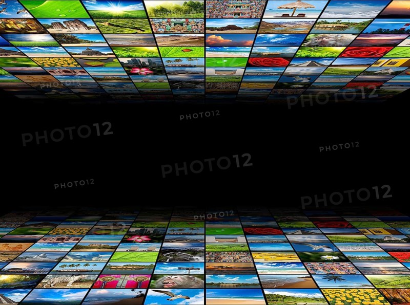 Abstract multimedia background composed of many images with copyspace in the center