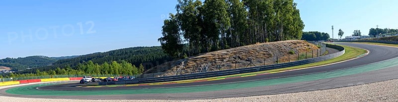 Panoramic photo of steeply descending turn 8 of Circuit de Spa Francorchamps