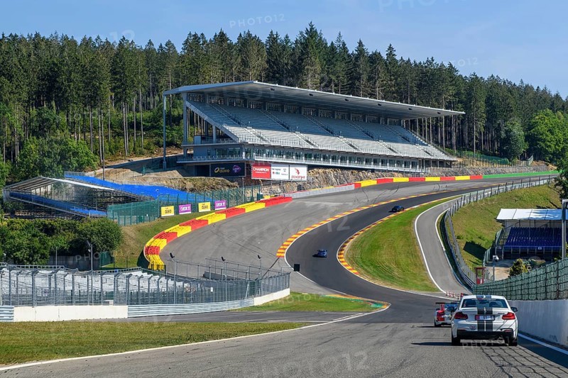 View from the perspective of a racing driver in front of overtaking in the dangerous Eau Rouge bend