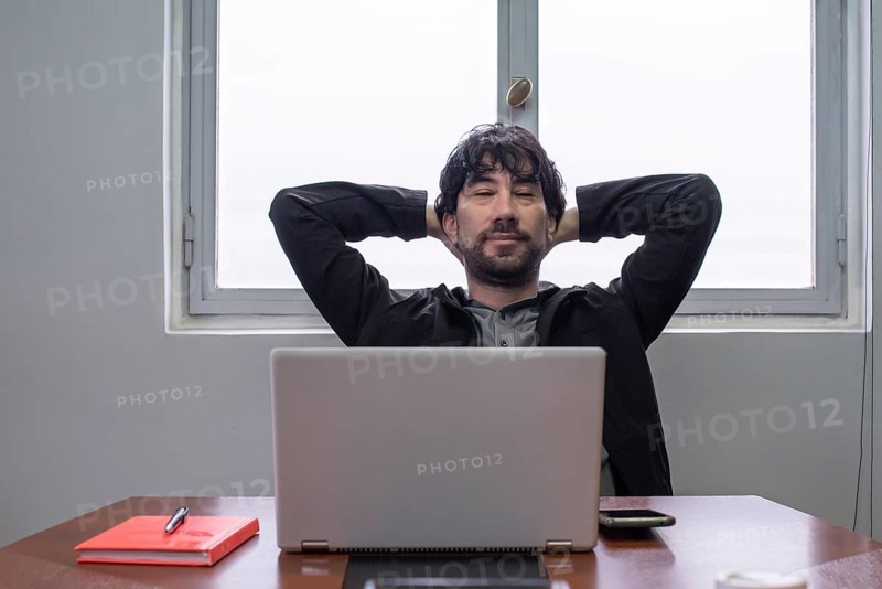 Relaxed businessman at the work desk